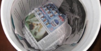 newspaper in trash can